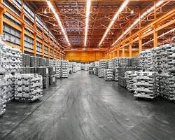 stacked aluminum ingots in warehouse industrial metal storage and supply